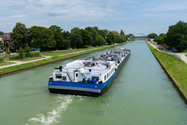istock A barge moves smoothly through a tranquil canal 2165505277