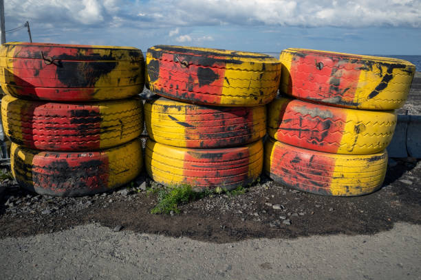 Red and yellow tire barrier at a construction site