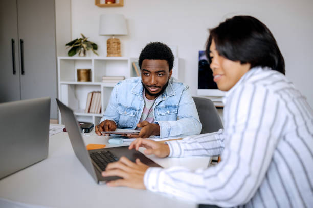 istock Two young male colleagues working together at the modern office 2165512046
