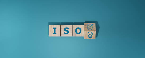 istock ISO quality control certification concept. wooden cubes with the abbreviation ISO with a check mark. 2165512241