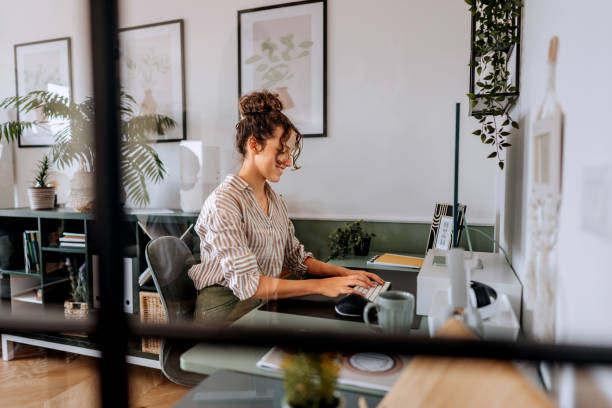 istock Young beautiful businesswoman using desktop PC at the modern office 2165512944