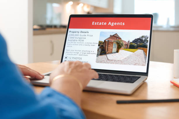 istock Exploring Real Estate Listings on a Laptop While Enjoying Coffee at Home 2165516007
