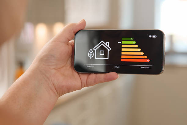 istock Smart Home Energy Management Displayed on a Smartphone in a Modern Kitchen Environment 2165517096