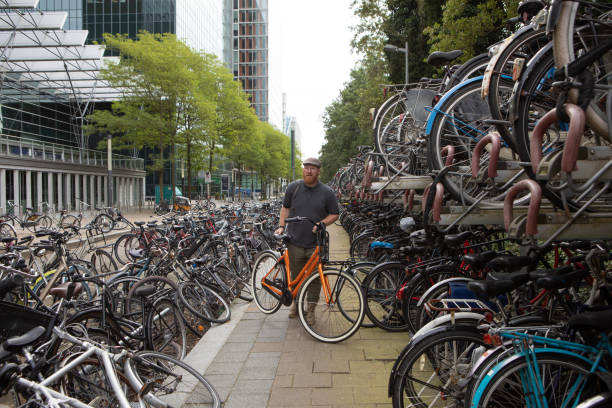 Redhead senior tourist at an Amsterdam bicycle storage location