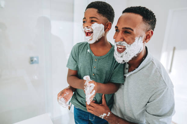 istock Father and son having fun shaving for Father's Day 2165517236