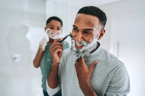 istock Father and son having fun shaving for Father's Day 2165517262
