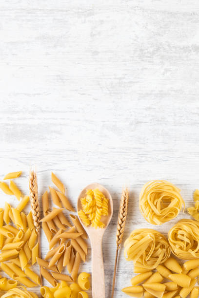 istock Italian Pasta on Rustic Wooden Table 2165519327