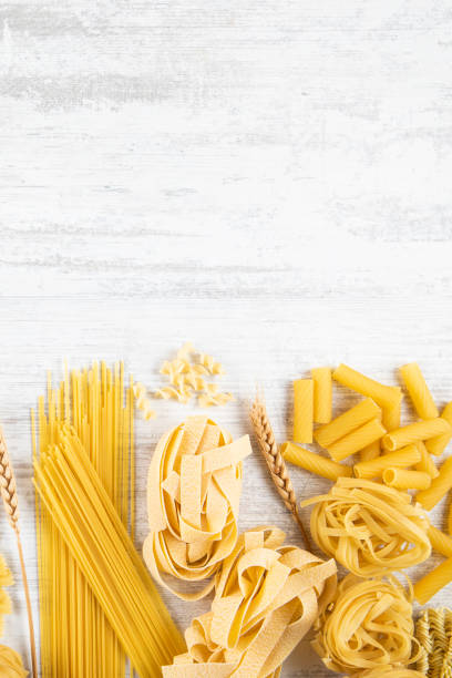 istock Italian Pasta on Rustic Wooden Table 2165519548