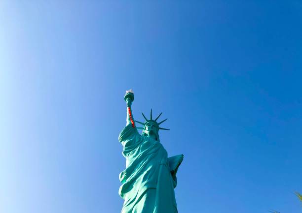 replica of Statue of liberty with a blue sky as the background