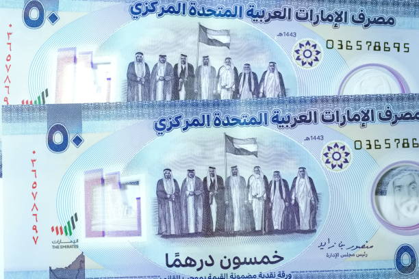 istock Close up Dirhams currency, AED, Bank note and coins, United Arab Emirates 2165521594