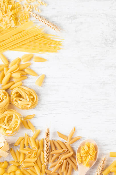 istock Italian Pasta on Rustic Wooden Table 2165521740
