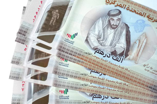 istock Close up Dirhams currency, AED, Bank note and coins, United Arab Emirates 2165522063