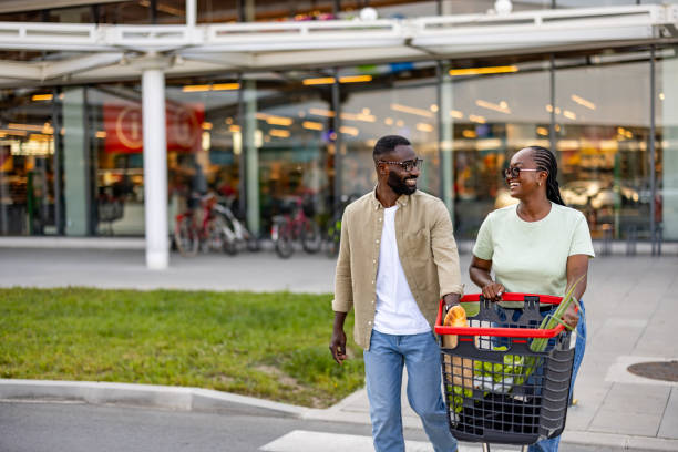 istock Joyful Black Couple Shopping 2165522224