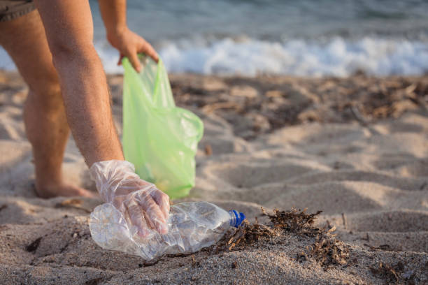 istock A man collecting litter, close-up 2165523910