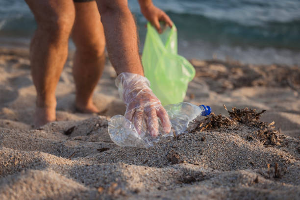istock A man collecting litter, close-up 2165523911