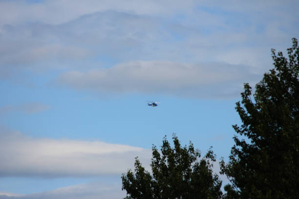 A helicopter flying far away in the air