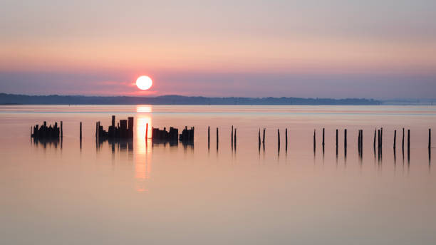 istock Seaside Sunrise Over Derelict Jetty 2165528453
