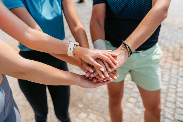 istock Three Friends Having A Team Handshake After Exercising Outdoors In Budapest In Hungary 2165528888