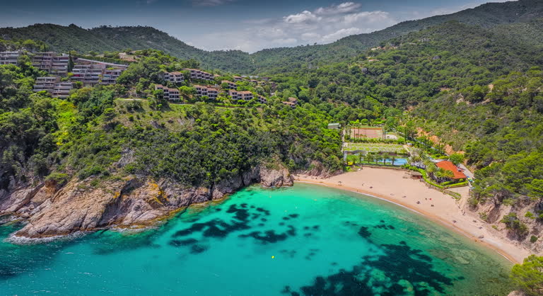 Idyllic beach Cala Giverola with turquoise water in Spain