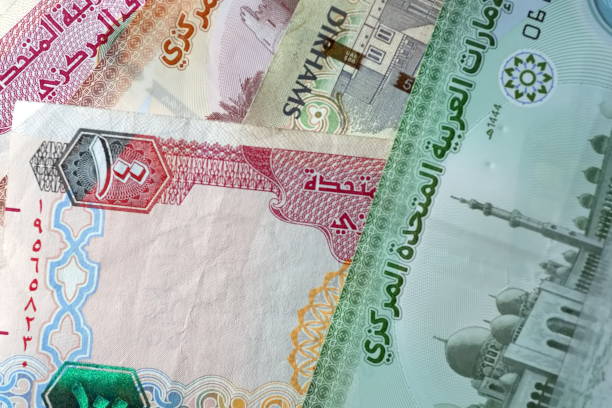 istock Close up Dirhams currency, AED, Bank note and coins, United Arab Emirates 2165531428