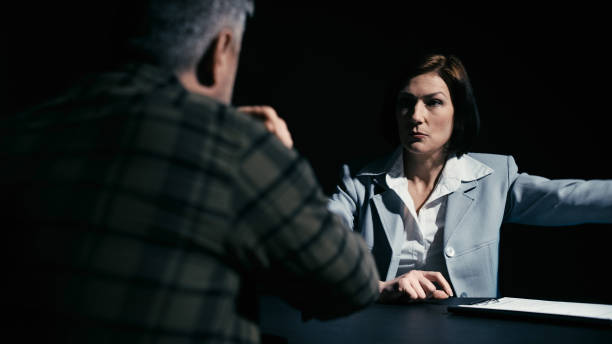 istock Police detective arguing with an arrested man refusing to sign papers 2165533425