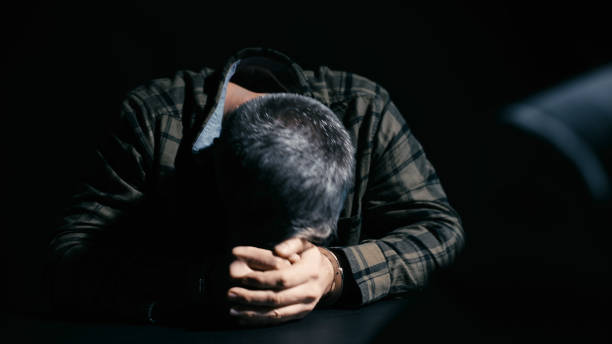 istock Arrested man feeling guilt and despair during interrogation with a detective 2165533472