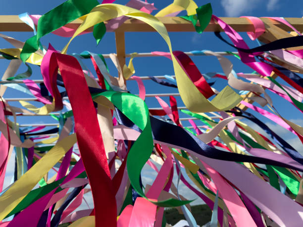 istock Multi-colored ribbons against a blue sky 2165535186