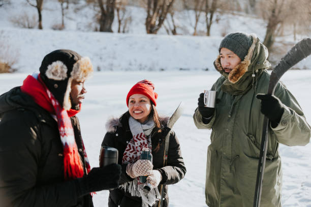 istock Friends drinking tea and having a chat outdoors at winter 2165535815