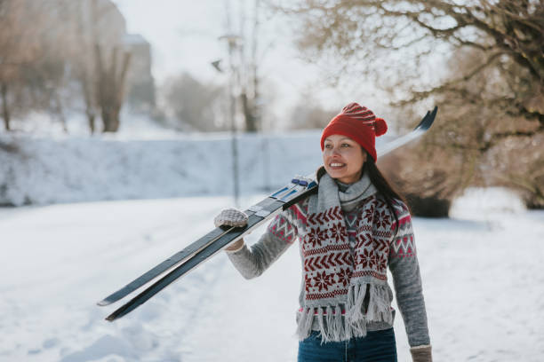 istock Woman going skiing on a beautiful winter day 2165535824