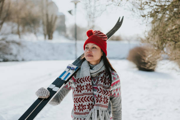 istock Woman going skiing on a beautiful winter day 2165535826