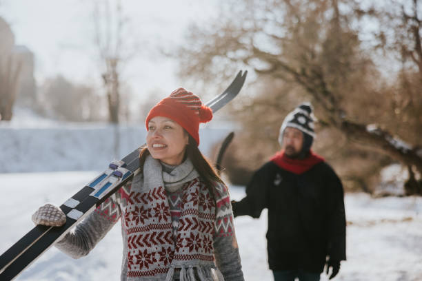Friends going skiing together on a sunny winter day