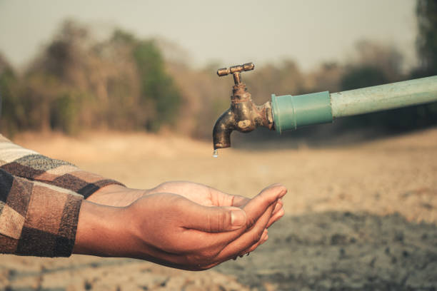 istock Hand for drinking water to live through drought, Concept drought and crisis environment. 2165536098