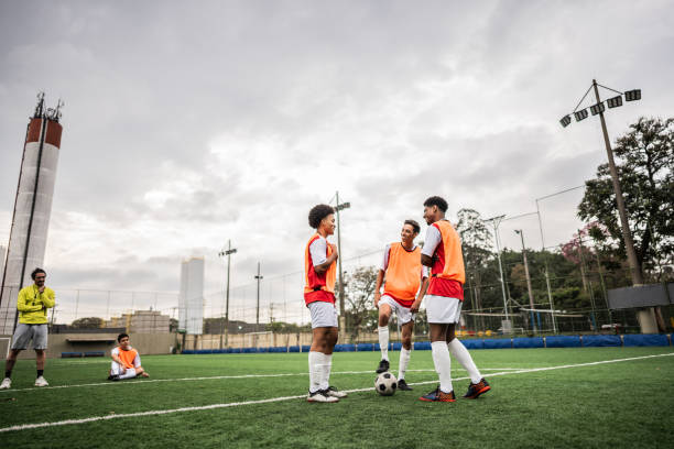 istock Soccer players talking on soccer field 2165538176