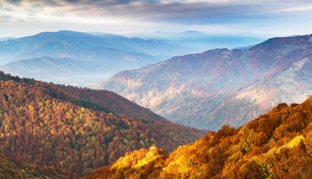 istock Picturesque autumn mountains ranges with red beech forest 2165540211