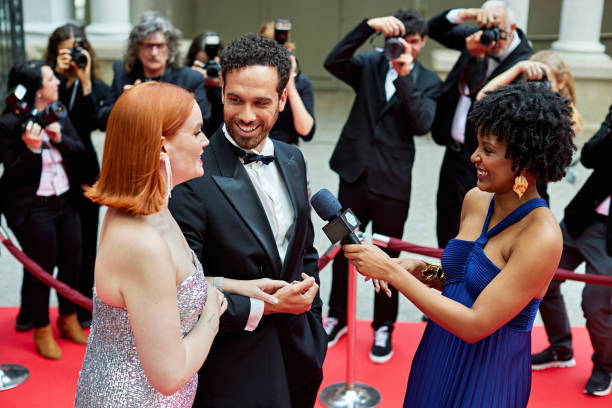 istock Candid interview with celebrity couple at red carpet event 2165542798