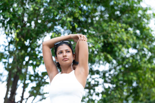 istock Woman warming up body, stretching arms 2165543703