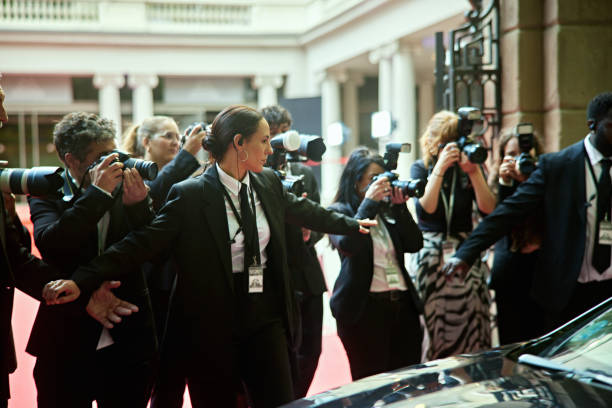 istock Security staff protecting arrival of celebrity in car 2165544746