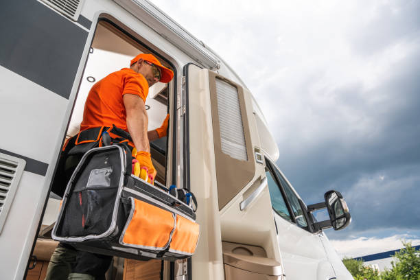 istock Technician Entering RV With Tool Bag Needed For Repair. 2165545263