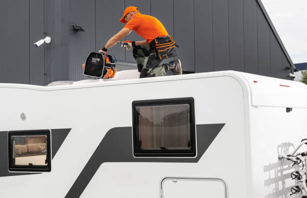 istock RV Technician Worker with Tool Bag on Camper Roof Preparing For AC Unit Repair 2165545418