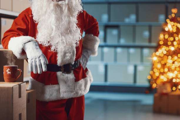 istock Confident Santa Claus posing in the warehouse 2165545554