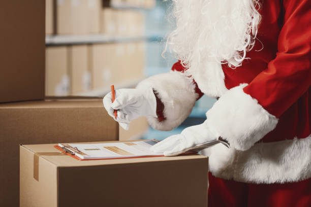 istock Santa Claus working at the warehouse 2165546250