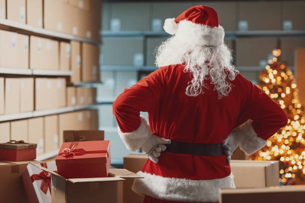istock Confident Santa Claus posing in the warehouse 2165546425
