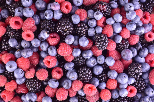 istock Background of raspberries, blueberries, blackberries. Flat lei. 2165546468