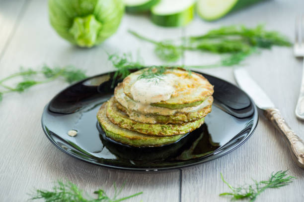 istock zucchini fried in batter with sauce 2165546783