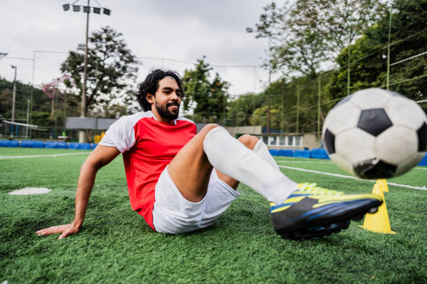 istock Soccer player making tricks with the ball on soccer field 2165547000