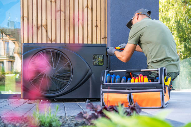 istock Technician Installing Air Conditioning Unit at Residential Property During Daytime 2165547353