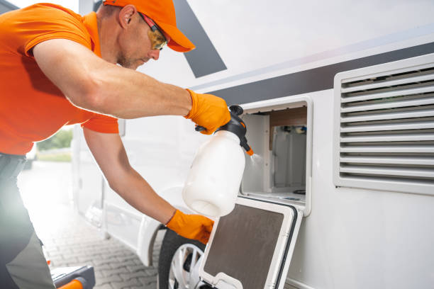 istock Technician Cleaning RV Toilet Cassette Compartment With Spray Bottle 2165548544