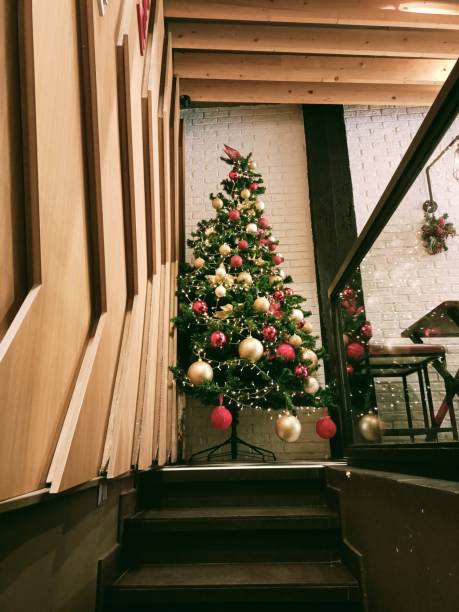 new year cozy home interior with christmas tree and garlands