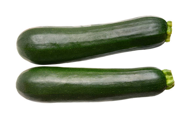 istock Green zucchini isolated isolated on white 2165557855