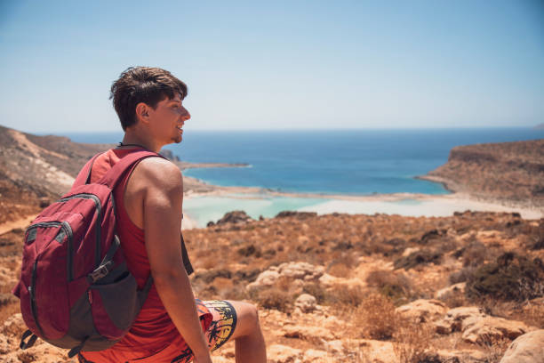 istock Young Man enjoying view on Balos beach, Crete 2165559336